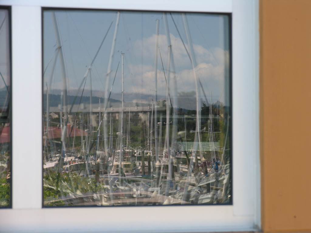 Squalicum Harbor reflected in the boathouse window